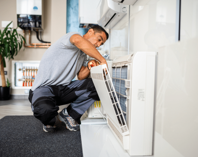 man working on an air filter